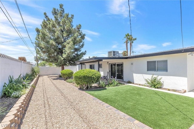 single story home with stucco siding and central air condition unit