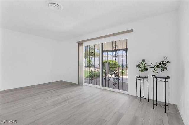 unfurnished room featuring wood finished floors