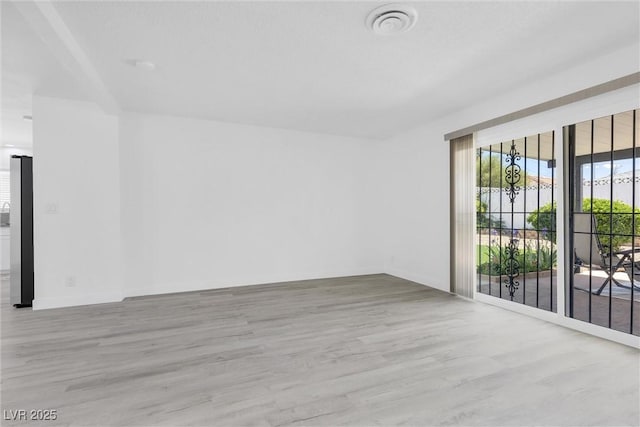 empty room with wood finished floors