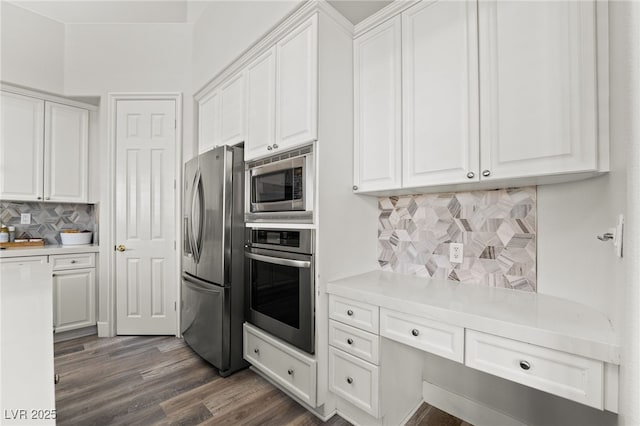 5684 Benevento Ct, Las Vegas, NV 89141 - kitchen featuring appliances with stainless steel finishes, white cabinets, tasteful backsplash, light countertops, and dark wood-style floors