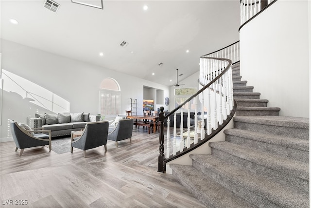 5684 Benevento Ct, Las Vegas, NV 89141 - stairs featuring a ceiling fan, wood finished floors, high vaulted ceiling, and recessed lighting
