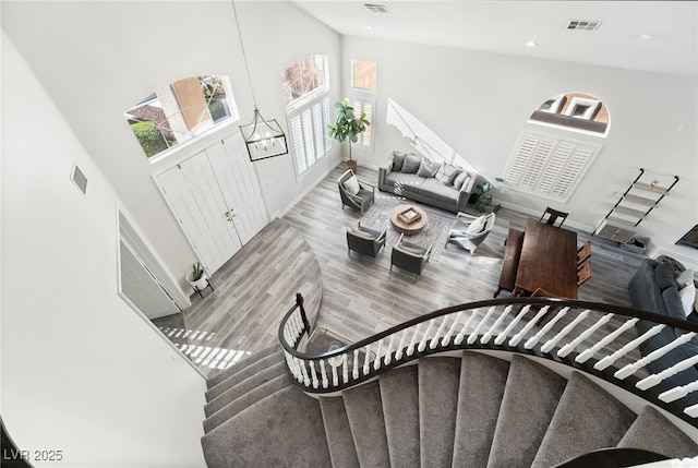 5684 Benevento Ct, Las Vegas, NV 89141 - stairs with a towering ceiling, wood finished floors, baseboards, and recessed lighting