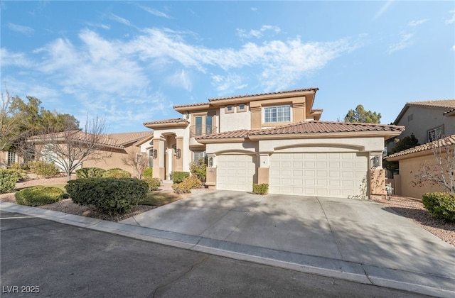 5684 Benevento Ct, Las Vegas, NV 89141 - mediterranean / spanish home featuring stucco siding, concrete driveway, a tiled roof, and a garage