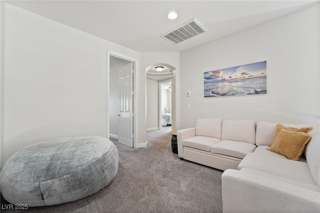 5684 Benevento Ct, Las Vegas, NV 89141 - carpeted living room with arched walkways and baseboards