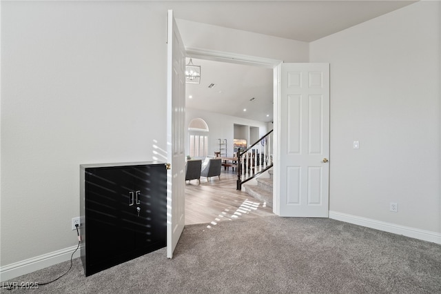 5684 Benevento Ct, Las Vegas, NV 89141 - carpeted spare room with baseboards and stairs