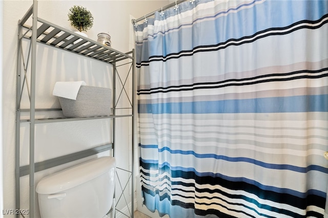 5684 Benevento Ct, Las Vegas, NV 89141 - bathroom featuring curtained shower and toilet