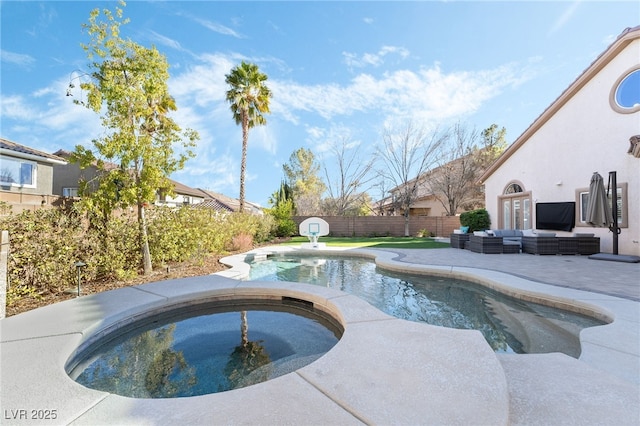 5684 Benevento Ct, Las Vegas, NV 89141 - view of swimming pool with outdoor lounge area, an in-ground hot tub, a fenced backyard, and a patio