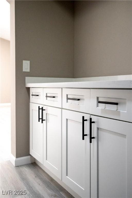 detailed view of wood finished floors and baseboards