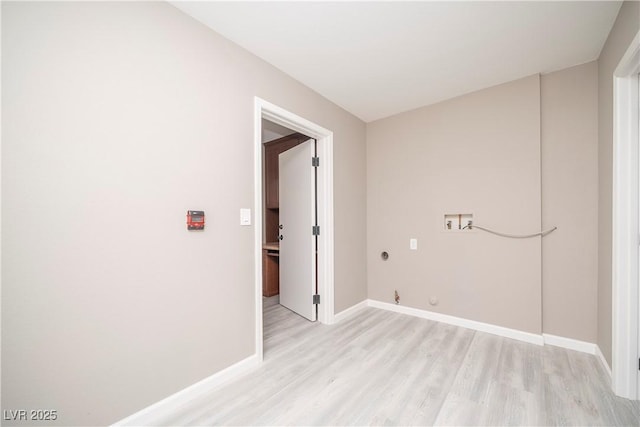 laundry room featuring hookup for a washing machine, light wood finished floors, hookup for a gas dryer, and baseboards