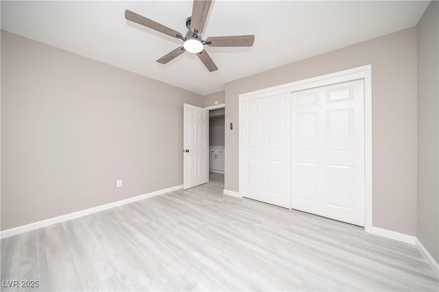 unfurnished bedroom with light wood-style flooring, baseboards, a closet, and a ceiling fan