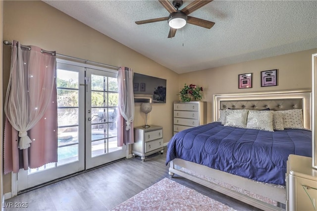 6408 Deadwood Rd, Las Vegas, NV 89108 - bedroom with a textured ceiling, vaulted ceiling, access to exterior, wood finished floors, and ceiling fan