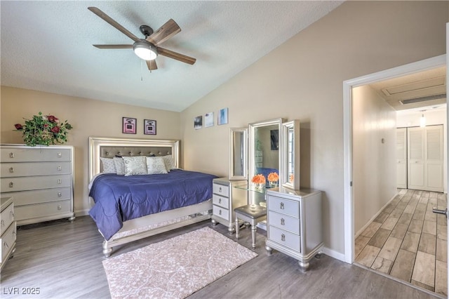 6408 Deadwood Rd, Las Vegas, NV 89108 - bedroom with lofted ceiling, wood finished floors, a textured ceiling, baseboards, and ceiling fan