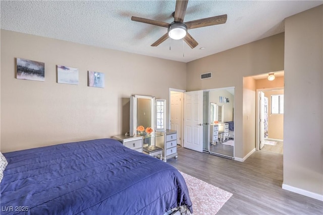 6408 Deadwood Rd, Las Vegas, NV 89108 - bedroom featuring wood finished floors, baseboards, a textured ceiling, and ceiling fan