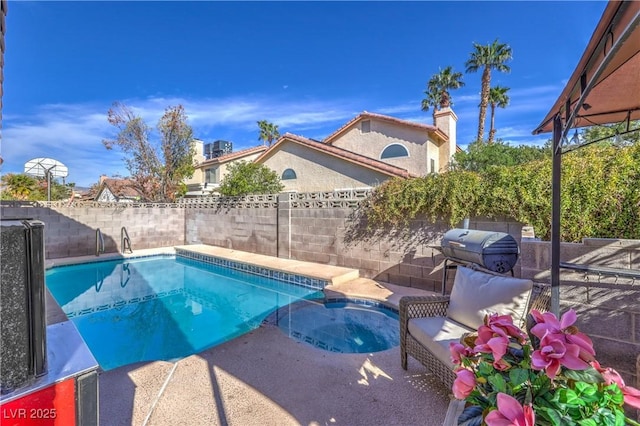 6408 Deadwood Rd, Las Vegas, NV 89108 - view of pool with a fenced backyard, a patio, and a pool with connected hot tub