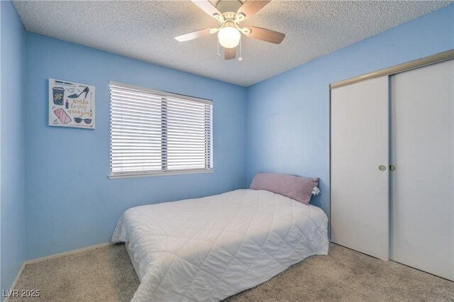 6408 Deadwood Rd, Las Vegas, NV 89108 - carpeted bedroom with a closet, a textured ceiling, and ceiling fan