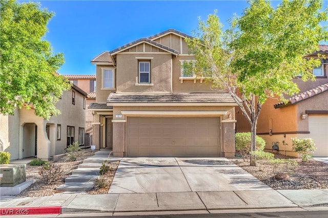 view of front of house with stucco siding, a garage, a tiled roof, and driveway