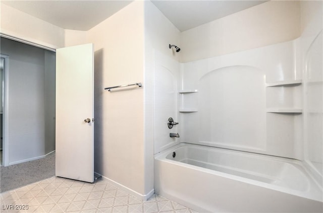 bathroom with baseboards, bathtub / shower combination, and tile patterned floors