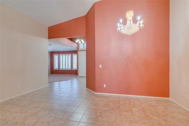 2587 Grizzly Park Ct, Henderson, NV 89052 - empty room featuring a chandelier, baseboards, high vaulted ceiling, and light tile patterned flooring