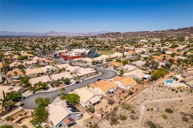2587 Grizzly Park Ct, Henderson, NV 89052 - aerial view of property's location with a mountainous background and nearby suburban area