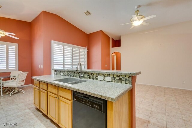 2587 Grizzly Park Ct, Henderson, NV 89052 - kitchen featuring dishwasher, a ceiling fan, vaulted ceiling, a sink, and decorative backsplash