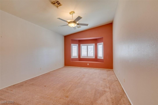 2587 Grizzly Park Ct, Henderson, NV 89052 - spare room with light colored carpet, vaulted ceiling, ceiling fan, and baseboards