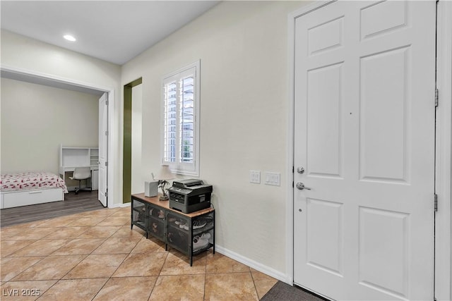 entrance foyer with baseboards, light tile patterned floors, and recessed lighting