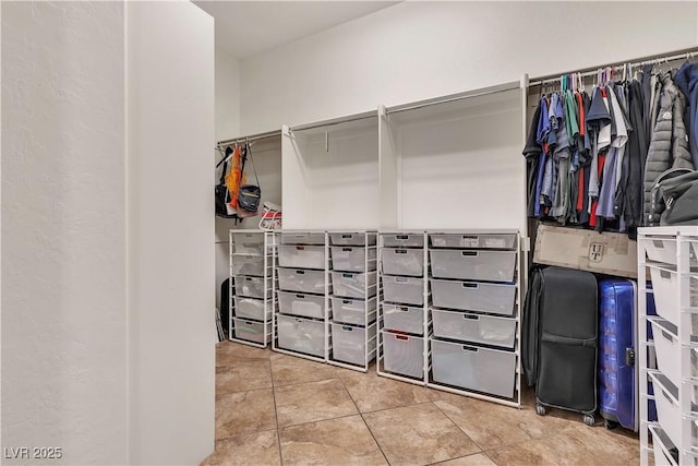 spacious closet featuring tile patterned floors