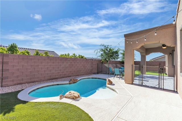 view of pool with a fenced backyard, a patio area, and ceiling fan