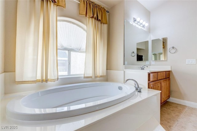 1963 Dakota Lodge Ave, Las Vegas, NV 89123 - bathroom featuring vanity, a bath, baseboards, and tile patterned floors