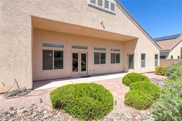 1963 Dakota Lodge Ave, Las Vegas, NV 89123 - back of property with stucco siding and a patio area