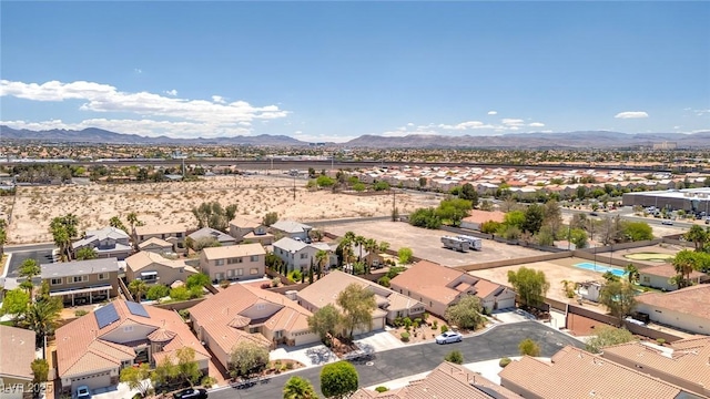 aerial view of residential area with a mountainous background