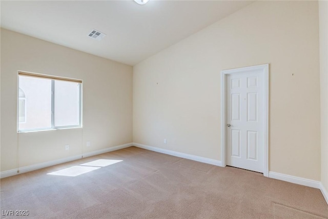 1963 Dakota Lodge Ave, Las Vegas, NV 89123 - unfurnished room with light colored carpet, baseboards, and vaulted ceiling