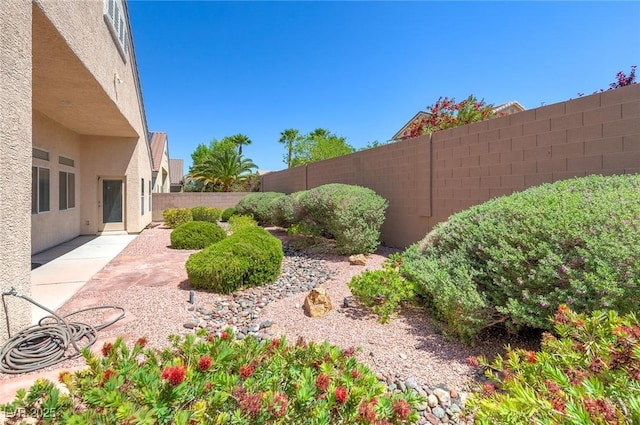 fenced backyard with a patio area