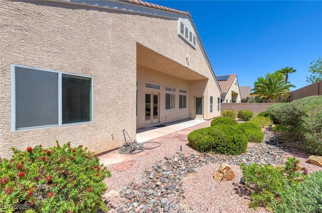 1963 Dakota Lodge Ave, Las Vegas, NV 89123 - rear view of property with stucco siding, a fenced backyard, and a patio