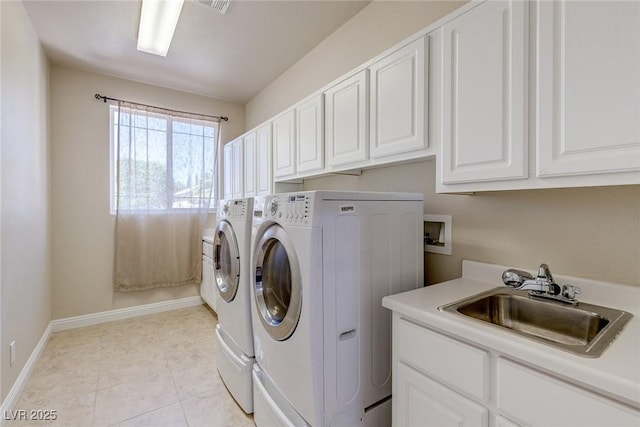 1963 Dakota Lodge Ave, Las Vegas, NV 89123 - laundry room featuring separate washer and dryer, cabinet space, and baseboards