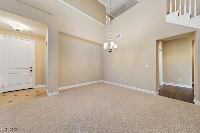 7438 Desertscape Ave, Las Vegas, NV 89178 - entrance foyer featuring a chandelier, carpet floors, baseboards, and a towering ceiling