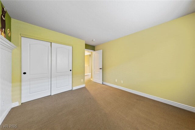 7438 Desertscape Ave, Las Vegas, NV 89178 - unfurnished bedroom featuring carpet, baseboards, and a closet