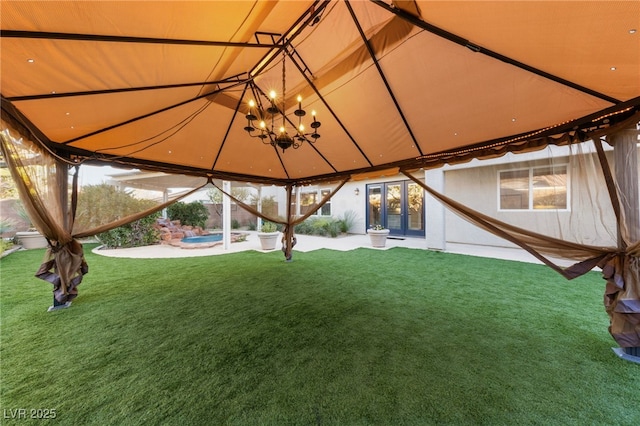 7438 Desertscape Ave, Las Vegas, NV 89178 - view of grassy yard with a gazebo and french doors
