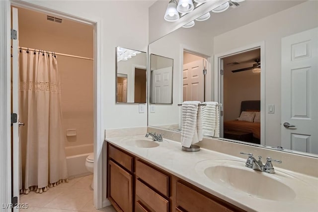full bath with double vanity, tile patterned floors, shower / bathtub combination with curtain, toilet, and ensuite bath