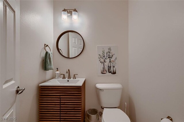 half bath with toilet and vanity