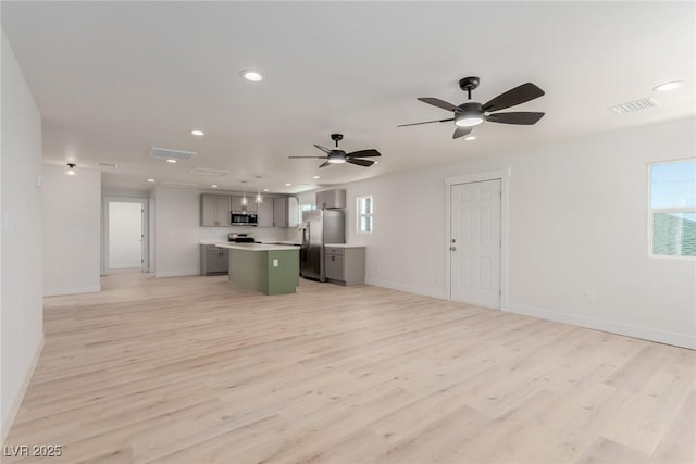 663 D Ave, Boulder City, NV 89005 - kitchen featuring appliances with stainless steel finishes, open floor plan, a kitchen island, gray cabinetry, and recessed lighting