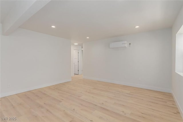 663 D Ave, Boulder City, NV 89005 - unfurnished room with an AC wall unit, light wood finished floors, recessed lighting, and baseboards