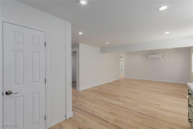 663 D Ave, Boulder City, NV 89005 - below grade area featuring baseboards, recessed lighting, light wood-style flooring, and a wall mounted AC