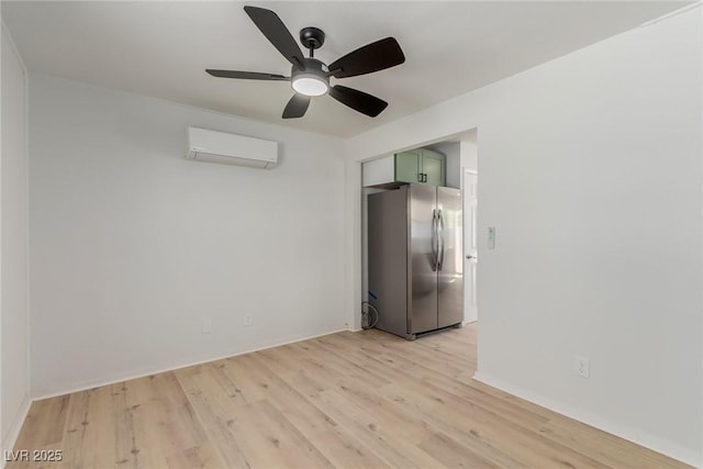 663 D Ave, Boulder City, NV 89005 - unfurnished room with a wall mounted air conditioner, light wood-style flooring, ceiling fan, and baseboards