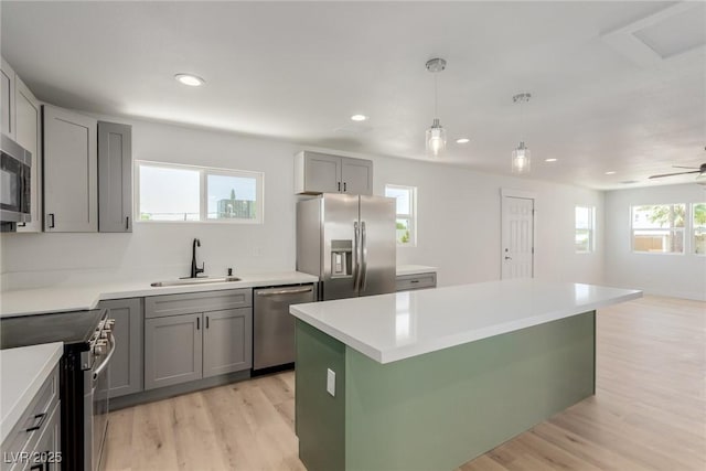663 D Ave, Boulder City, NV 89005 - kitchen featuring stainless steel appliances, a sink, gray cabinets, a kitchen island, and recessed lighting