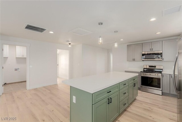 663 D Ave, Boulder City, NV 89005 - kitchen featuring stainless steel appliances, green cabinets, light wood-type flooring, light countertops, and recessed lighting
