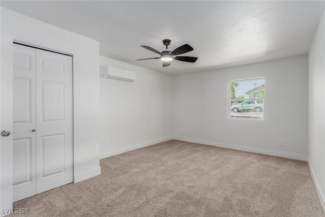 663 D Ave, Boulder City, NV 89005 - carpeted spare room with a wall mounted air conditioner, a ceiling fan, and baseboards