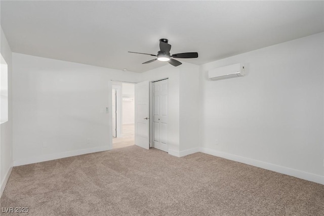 663 D Ave, Boulder City, NV 89005 - unfurnished bedroom with a wall unit AC, light carpet, baseboards, a closet, and ceiling fan