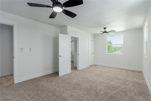 663 D Ave, Boulder City, NV 89005 - unfurnished bedroom featuring light carpet, baseboards, and a ceiling fan