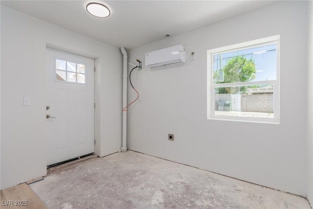 663 D Ave, Boulder City, NV 89005 - clothes washing area with a wall mounted air conditioner and hookup for an electric dryer